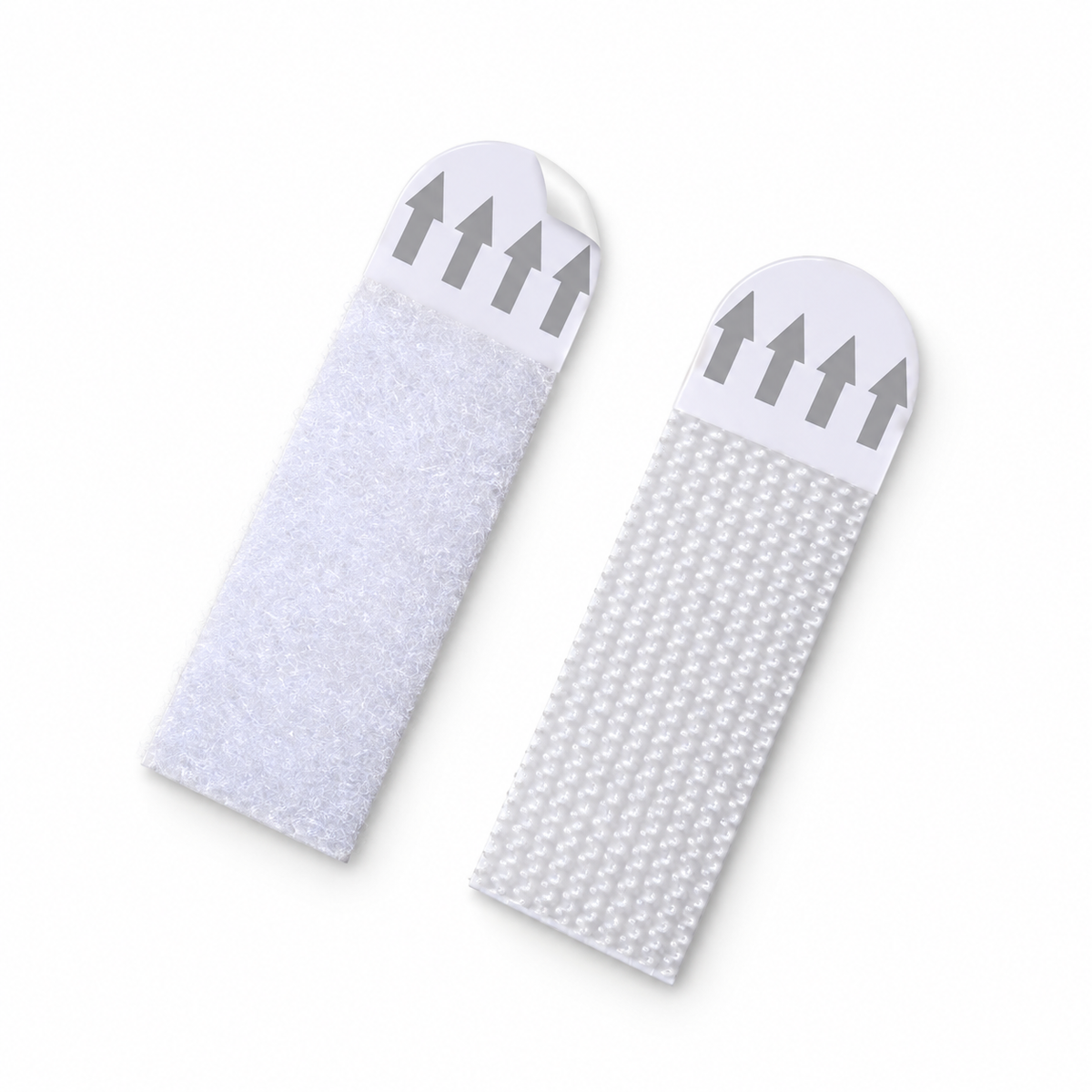 Close-up of one matching pair of white adhesive-backed picture hanging strips, showing the hook-and-loop fastening surfaces on a white background.